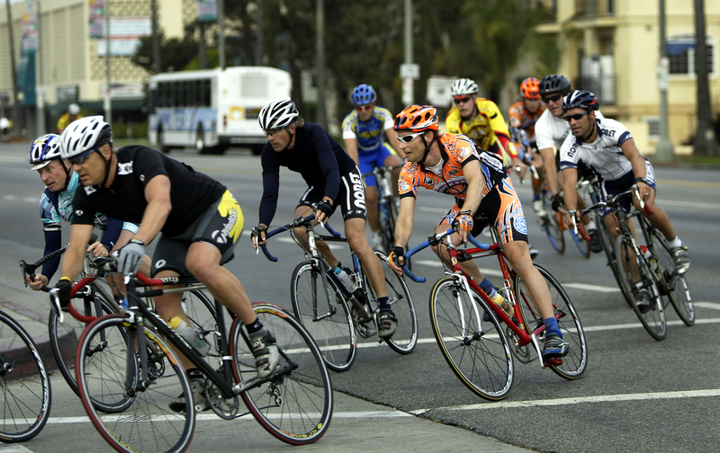 A group of cyclists ride through in Venice, California. An influx of wealthy home buyers is driving real estate prices up, and affordable housing for local residents out. A culture clash has caused an upheaval in local politics that resulted in a city council feud.